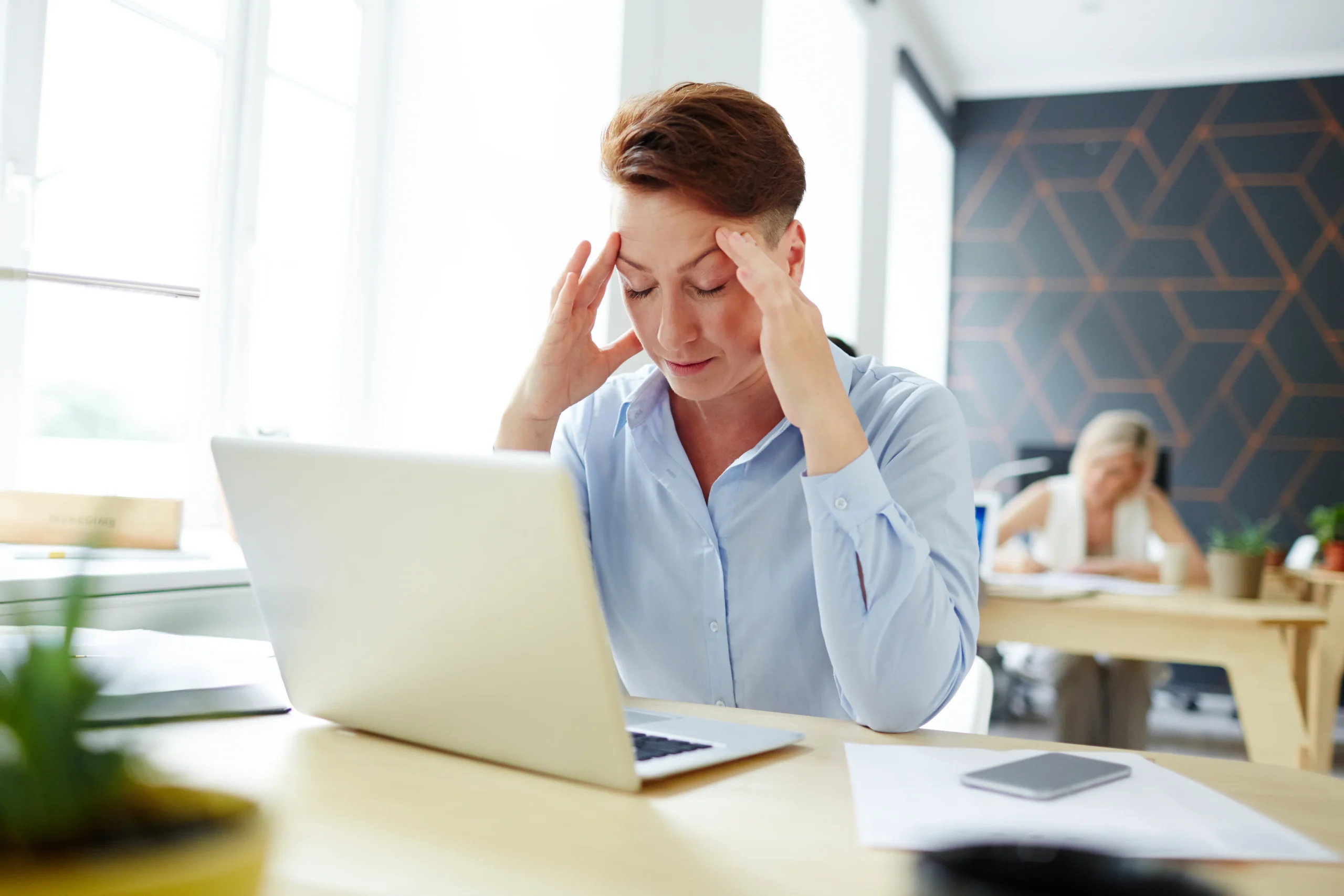 image of woman in stress in front of laptop